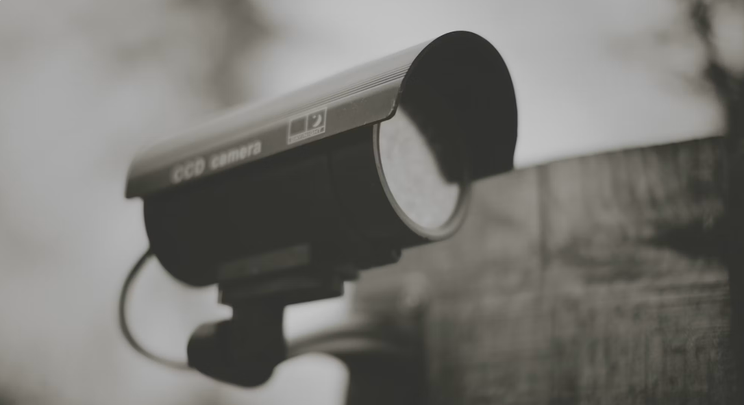 Photo: Cool Photos /
Unsplash — the same category of camera hardware now doubles as a walk-speed
authentication system at a growing list of American stadiums.