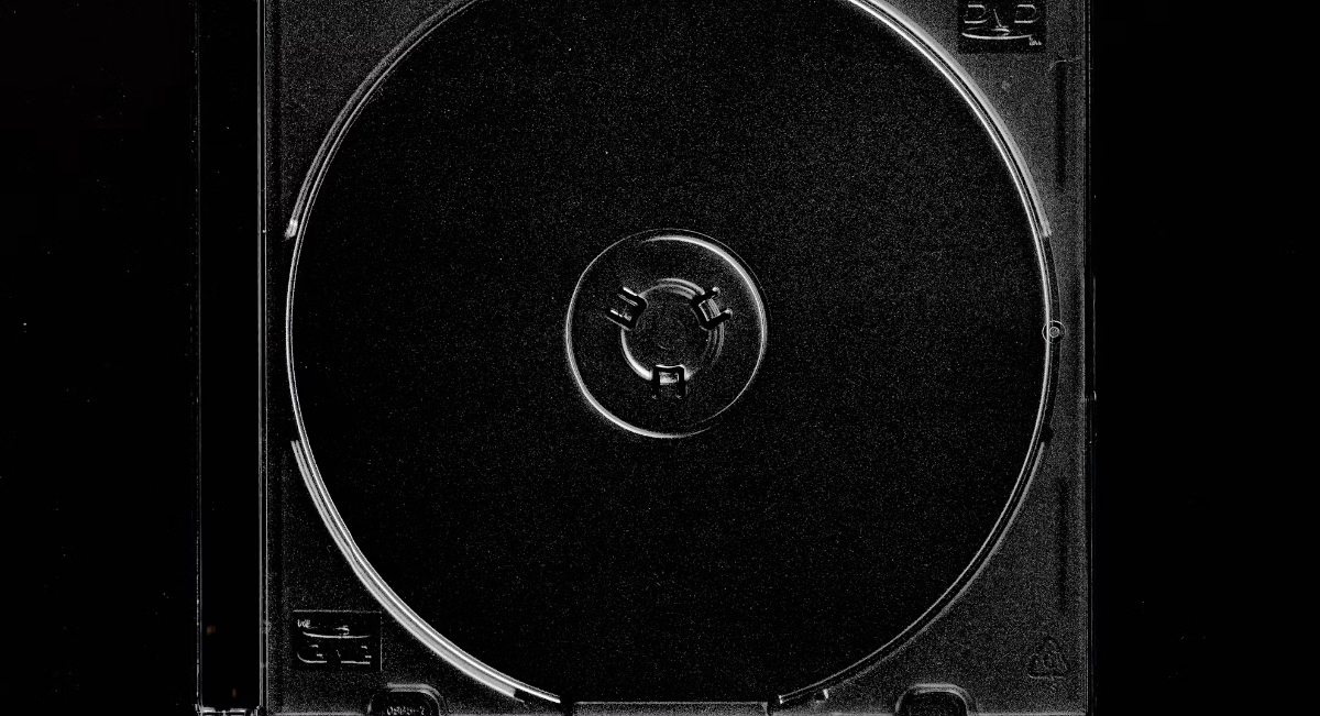 Photo: Valeria Reverdo / Unsplash — the stark,
minimalist black-and-white CD case image mirrors the kind of visual Drake
shared to reignite "FOMO 2026" speculation.