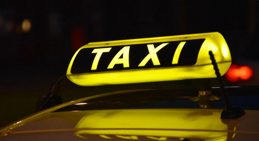 Photo: Waldemar Brandt /
Unsplash — a cab booked as one line in a larger agentic request, rather than a
separate app opened and operated on its own.